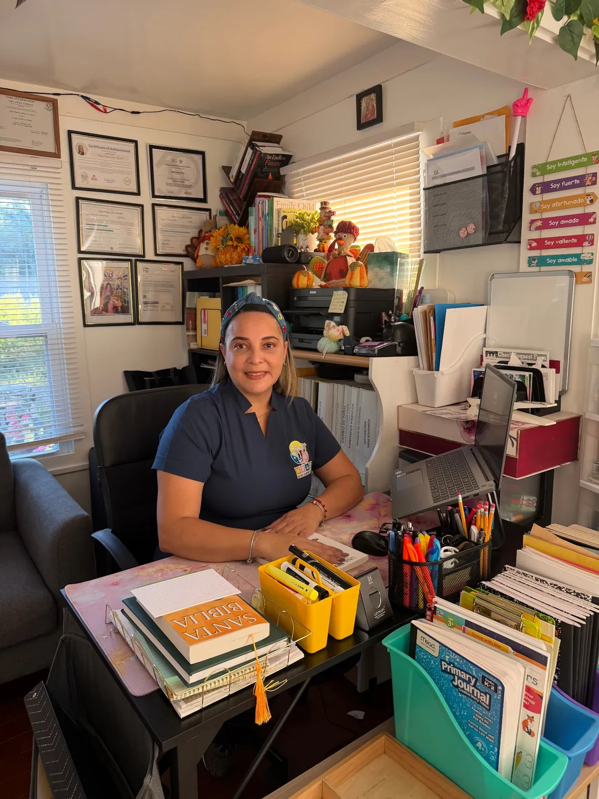 The daycare owner seated at her desk.